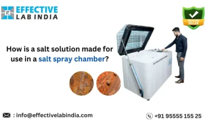 How is a salt solution made for use in a salt spray chamber?